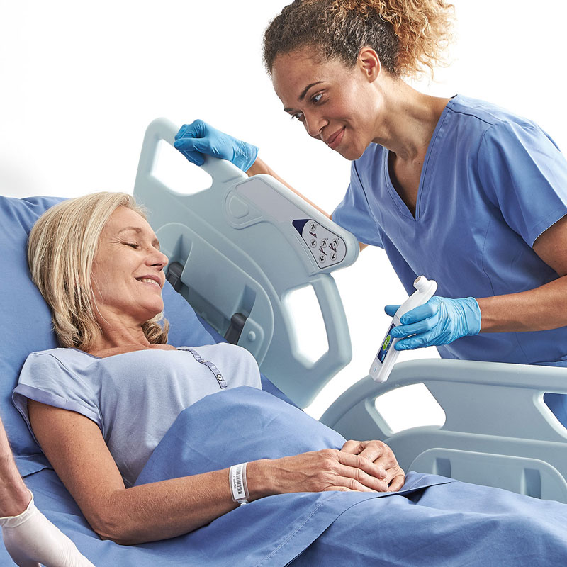 Nurse showing a female patient the Provizio SEM Scanner